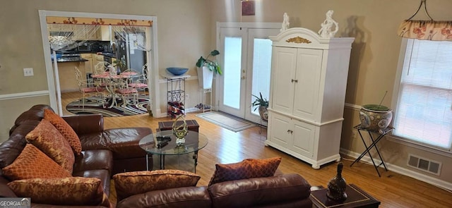 3715 Millers Pond Way, Snellville, GA 30039 - living area featuring wood finished floors, baseboards, and visible vents
