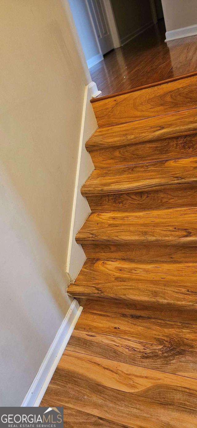 3715 Millers Pond Way, Snellville, GA 30039 - stairway with baseboards and wood finished floors