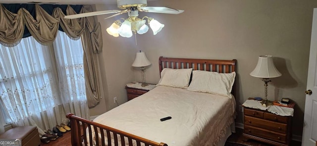 3715 Millers Pond Way, Snellville, GA 30039 - bedroom with a ceiling fan, multiple windows, and wood finished floors