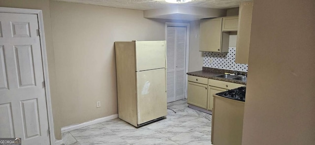 3715 Millers Pond Way, Snellville, GA 30039 - kitchen featuring a sink, freestanding refrigerator, marble finish floor, dark countertops, and decorative backsplash