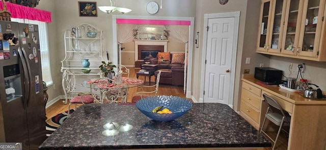 3715 Millers Pond Way, Snellville, GA 30039 - dining area with baseboards, a fireplace, and wood finished floors