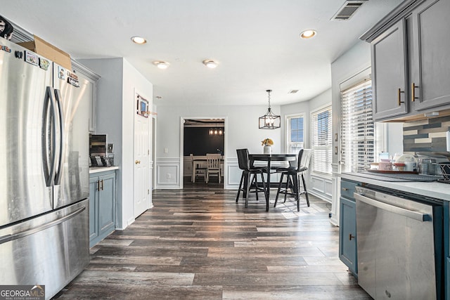 kitchen with visible vents, dark wood-style flooring, appliances with stainless steel finishes, recessed lighting, and gray cabinets