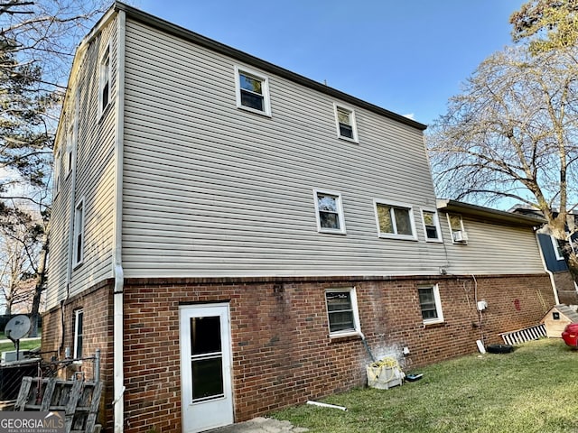 6917 Laurelwood Dr, Douglasville, GA 30135 - rear view of house featuring brick siding and a yard