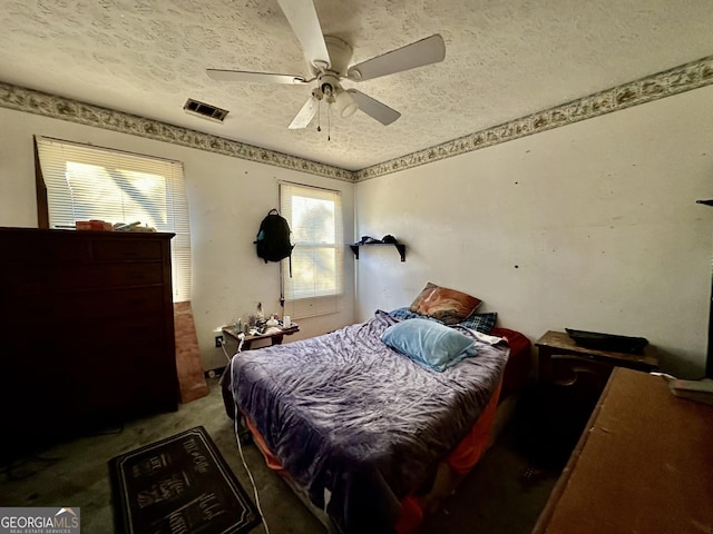 6917 Laurelwood Dr, Douglasville, GA 30135 - bedroom featuring a textured ceiling, carpet floors, and a ceiling fan