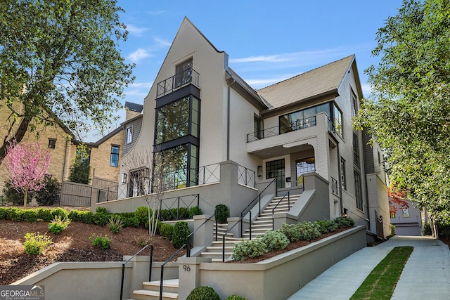 96 The Prado NE, Atlanta, GA 30309 - contemporary home featuring stairs, stucco siding, and a balcony