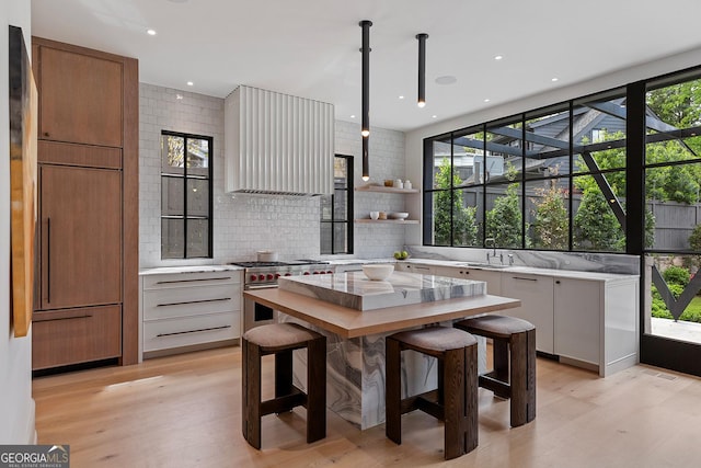 dining space featuring light wood-type flooring and recessed lighting
