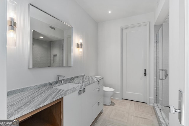 full bathroom with visible vents, toilet, vanity, tile patterned floors, and a stall shower