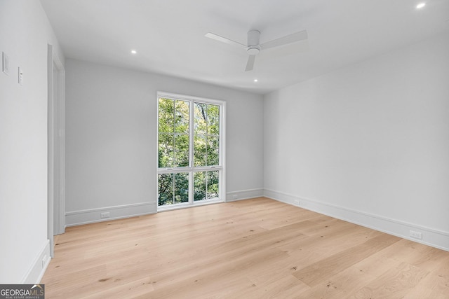 empty room featuring wood finished floors, ceiling fan, baseboards, and recessed lighting