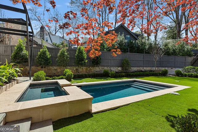 view of pool with a fenced in pool, fence, and a lawn