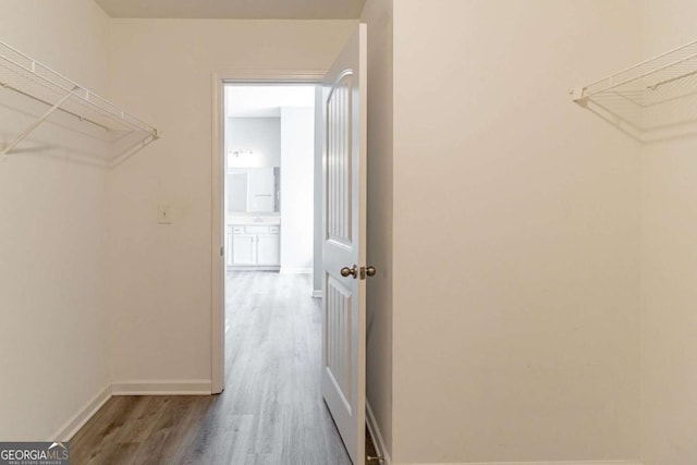 6399 Woodwell Dr, Union City, GA 30291 - spacious closet featuring wood finished floors
