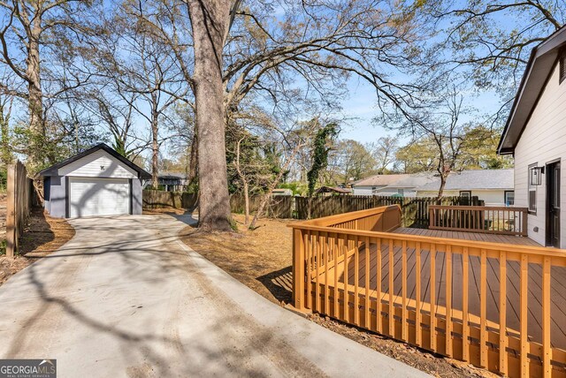 1569 Montreat Ave SW, Atlanta, GA 30311 - exterior space featuring a deck, driveway, fence, and a detached garage