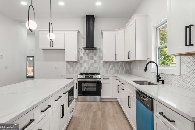 1569 Montreat Ave SW, Atlanta, GA 30311 - kitchen with wall chimney range hood, white cabinetry, stainless steel appliances, light wood finished floors, and a sink