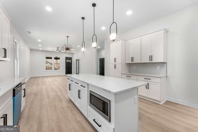 1569 Montreat Ave SW, Atlanta, GA 30311 - kitchen featuring tasteful backsplash, dishwasher, light wood-type flooring, stainless steel microwave, and recessed lighting