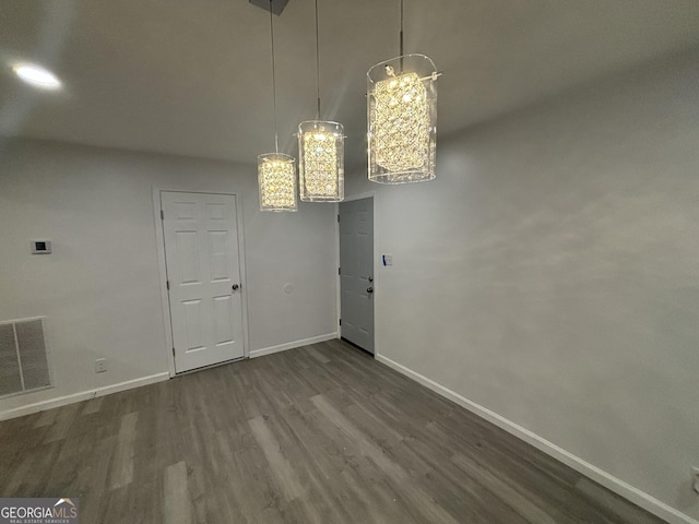 3685 Rice Mill Rd, Macon, GA 31206 - unfurnished dining area featuring dark wood-style flooring, baseboards, and a chandelier