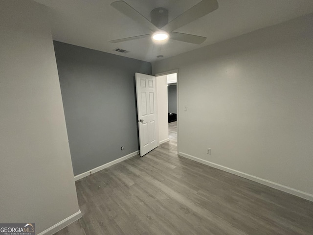 3685 Rice Mill Rd, Macon, GA 31206 - spare room featuring a ceiling fan, wood finished floors, and baseboards