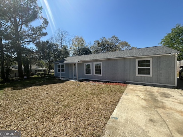 3685 Rice Mill Rd, Macon, GA 31206 - ranch-style home featuring a front yard, a shingled roof, and a patio