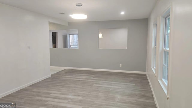 3685 Rice Mill Rd, Macon, GA 31206 - unfurnished room featuring baseboards, wood finished floors, and recessed lighting