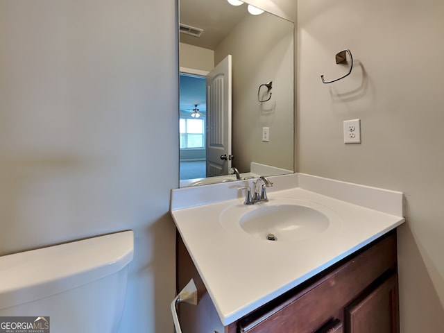 3741 Upland Dr, Mcdonough, GA 30253 - half bathroom featuring vanity and toilet