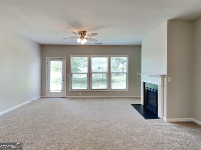 3741 Upland Dr, Mcdonough, GA 30253 - unfurnished living room with a fireplace with flush hearth, a ceiling fan, carpet floors, and baseboards