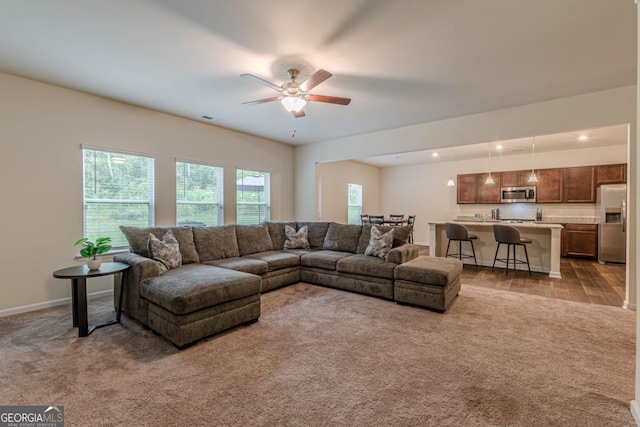9061 Jim Purcell Dr, Covington, GA 30014 - carpeted living room with ceiling fan and recessed lighting