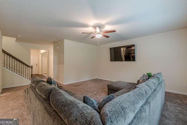 9061 Jim Purcell Dr, Covington, GA 30014 - living area featuring carpet flooring, ceiling fan, and stairway