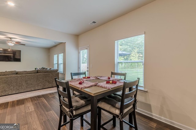 9061 Jim Purcell Dr, Covington, GA 30014 - dining space with dark wood-style flooring, healthy amount of natural light, and ceiling fan
