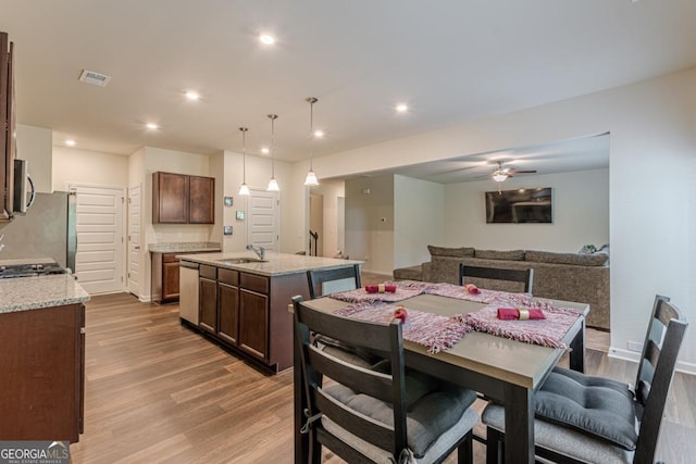 9061 Jim Purcell Dr, Covington, GA 30014 - dining room featuring wood finished floors, recessed lighting, and ceiling fan
