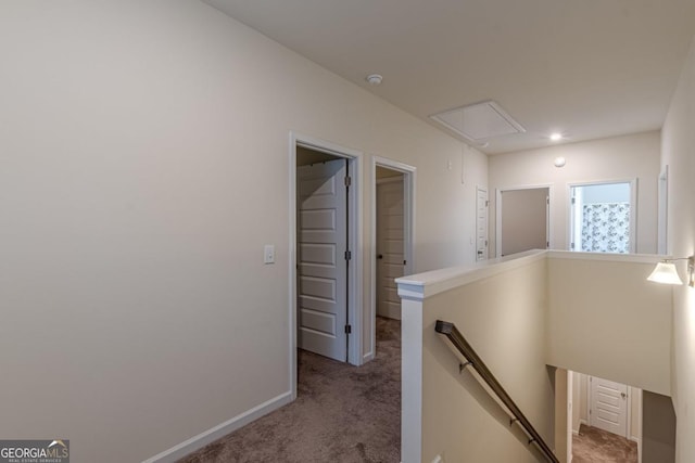 9061 Jim Purcell Dr, Covington, GA 30014 - hallway featuring attic access, an upstairs landing, and carpet flooring