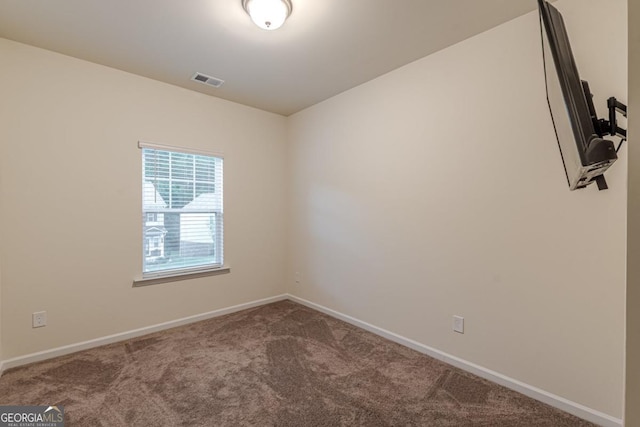 9061 Jim Purcell Dr, Covington, GA 30014 - carpeted spare room featuring baseboards