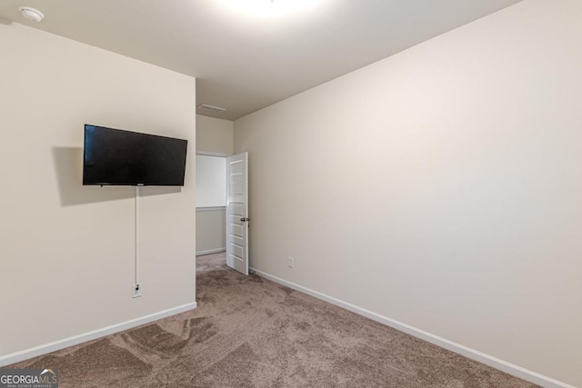 9061 Jim Purcell Dr, Covington, GA 30014 - unfurnished bedroom featuring carpet and baseboards
