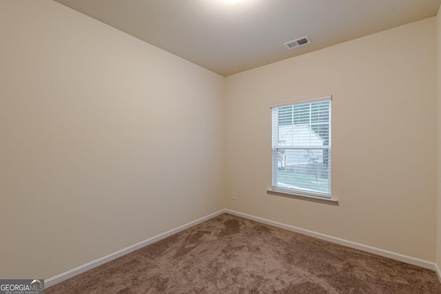 9061 Jim Purcell Dr, Covington, GA 30014 - carpeted spare room featuring baseboards
