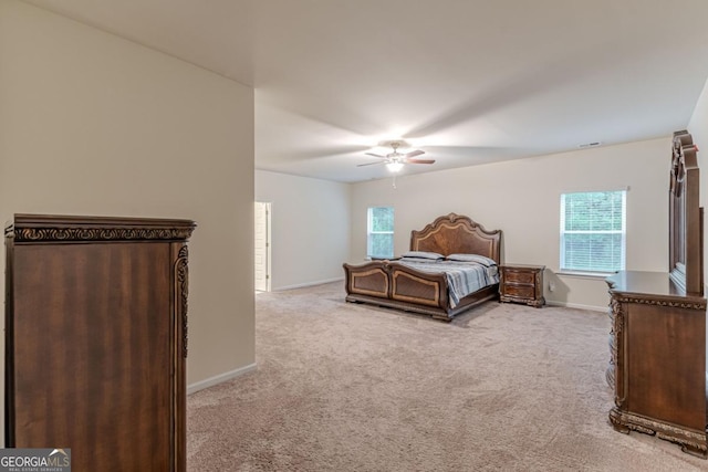 9061 Jim Purcell Dr, Covington, GA 30014 - bedroom with carpet flooring, multiple windows, and ceiling fan