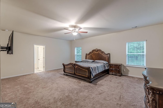 9061 Jim Purcell Dr, Covington, GA 30014 - bedroom featuring multiple windows, carpet flooring, and ceiling fan