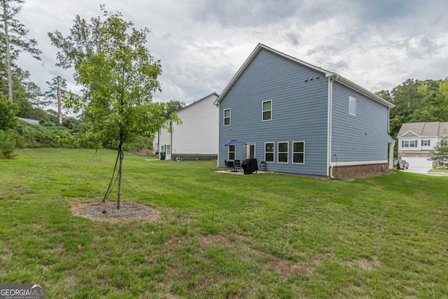 9061 Jim Purcell Dr, Covington, GA 30014 - rear view of house featuring a yard