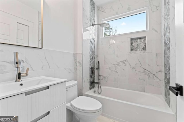 387 S Howard St SE, Atlanta, GA 30317 - bathroom with tile walls, vanity, and washtub / shower combination