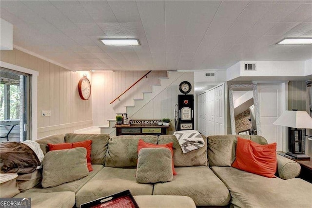 living area with visible vents and stairway
