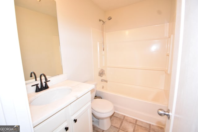 bathroom with vanity, toilet, and  shower combination