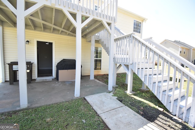 doorway to property with a patio area