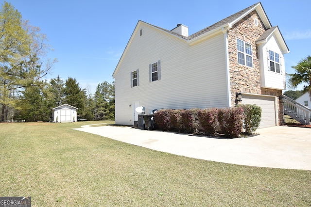 view of home's exterior featuring a chimney, an attached garage, concrete driveway, and stone siding