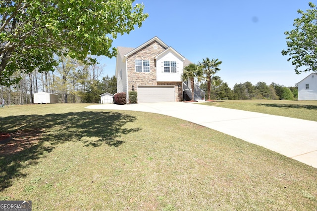 view of front of property with driveway, stone siding, a storage unit, an attached garage, and a front lawn