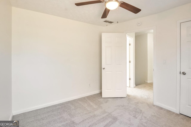 4785 Beaver Rd, Loganville, GA 30052 - unfurnished bedroom featuring baseboards, ceiling fan, visible vents, and light colored carpet