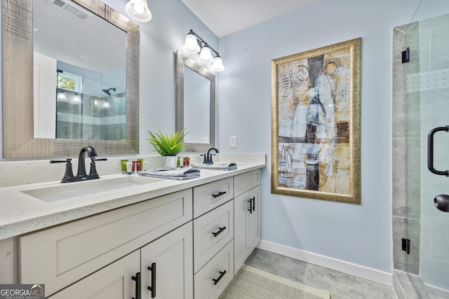 2535 Judson Ave, East Point, GA 30344 - bathroom with a sink, visible vents, a stall shower, double vanity, and baseboards