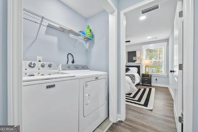 2535 Judson Ave, East Point, GA 30344 - laundry area with washing machine and clothes dryer and dark wood-type flooring