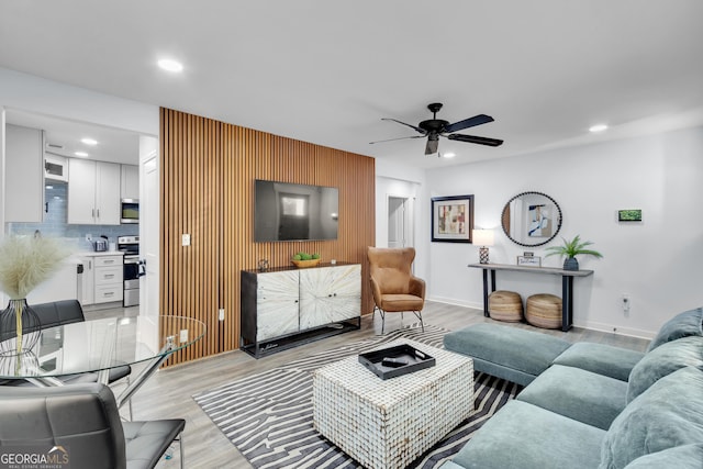 2535 Judson Ave, East Point, GA 30344 - living area with a ceiling fan, recessed lighting, light wood-style flooring, and an accent wall