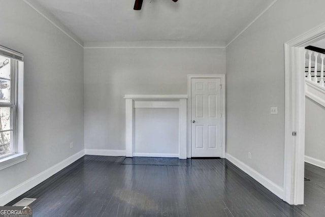 73 Atlanta Ave SW, Atlanta, GA 30315 - unfurnished room featuring baseboards, dark wood-style floors, and ceiling fan