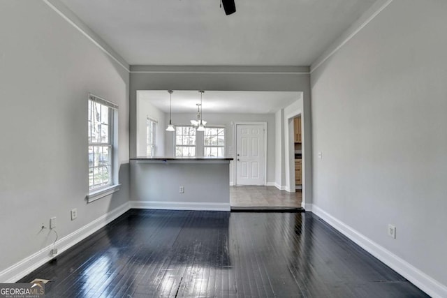 73 Atlanta Ave SW, Atlanta, GA 30315 - interior space featuring ceiling fan with notable chandelier, baseboards, and dark wood-style flooring