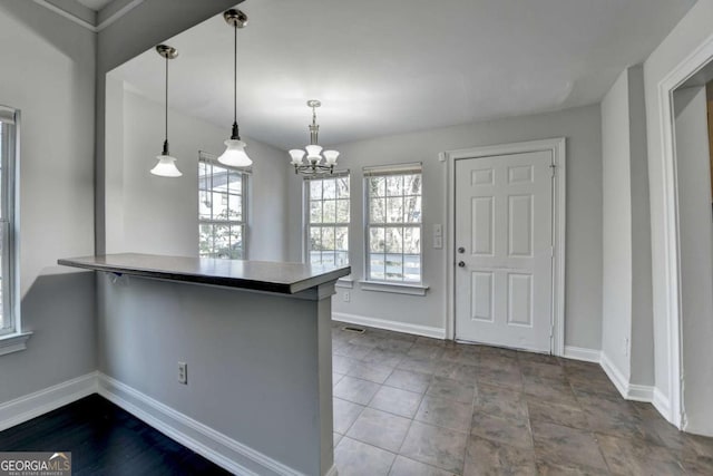 73 Atlanta Ave SW, Atlanta, GA 30315 - kitchen with baseboards, a notable chandelier, and a peninsula