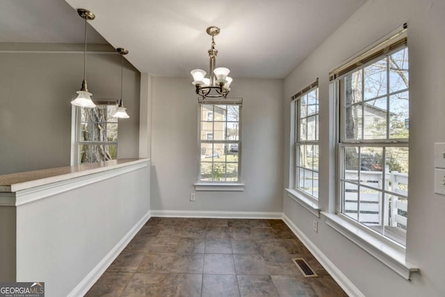 73 Atlanta Ave SW, Atlanta, GA 30315 - unfurnished dining area featuring baseboards, visible vents, and an inviting chandelier