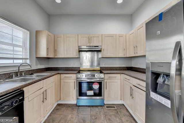 73 Atlanta Ave SW, Atlanta, GA 30315 - kitchen featuring dark countertops, appliances with stainless steel finishes, light brown cabinets, under cabinet range hood, and a sink