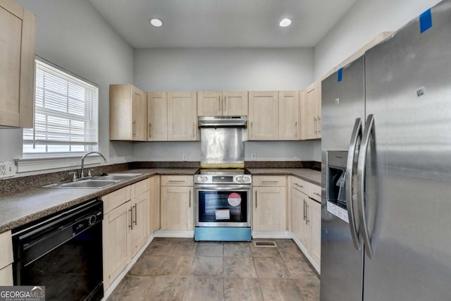 73 Atlanta Ave SW, Atlanta, GA 30315 - kitchen featuring light brown cabinetry, under cabinet range hood, a sink, dark countertops, and appliances with stainless steel finishes